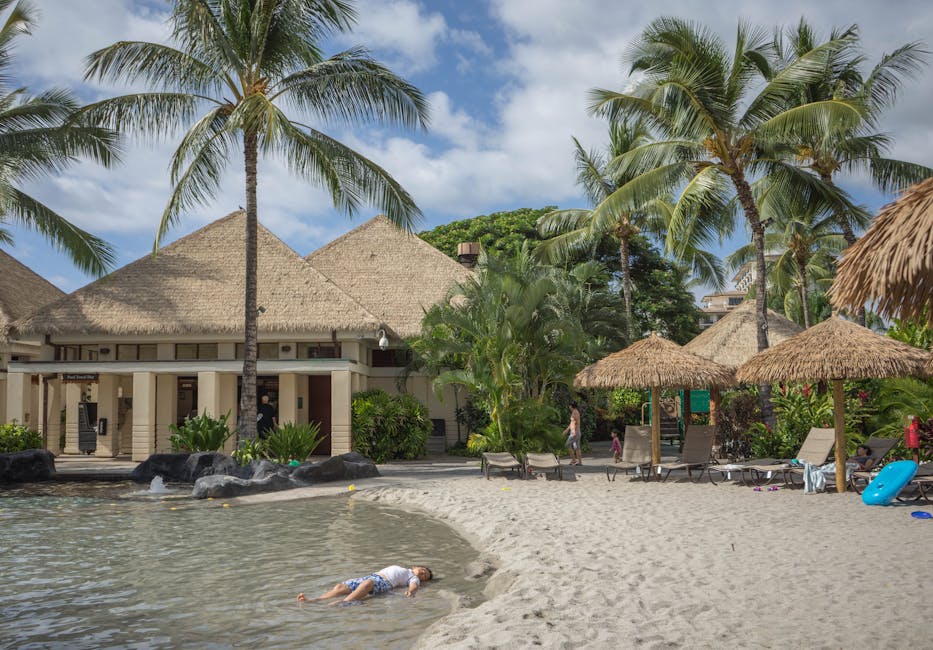 Serene beach resort with palm trees and sandy shore, ideal for relaxation and leisure